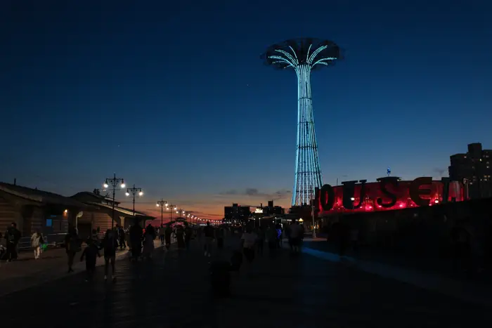 A photo of Coney Island at night